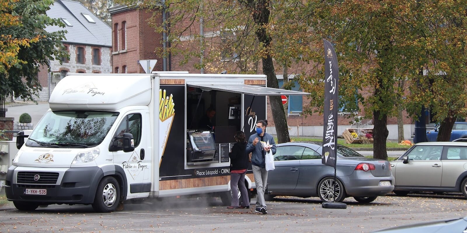 Customers getting food from a food truck