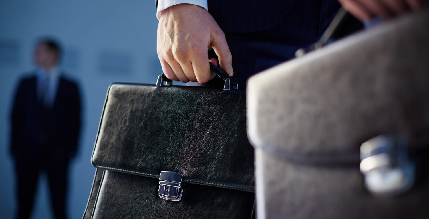 workers holding briefcases